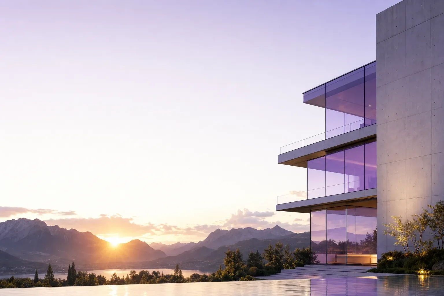 A building of concrete and glass above an alpine lake at sunset.
